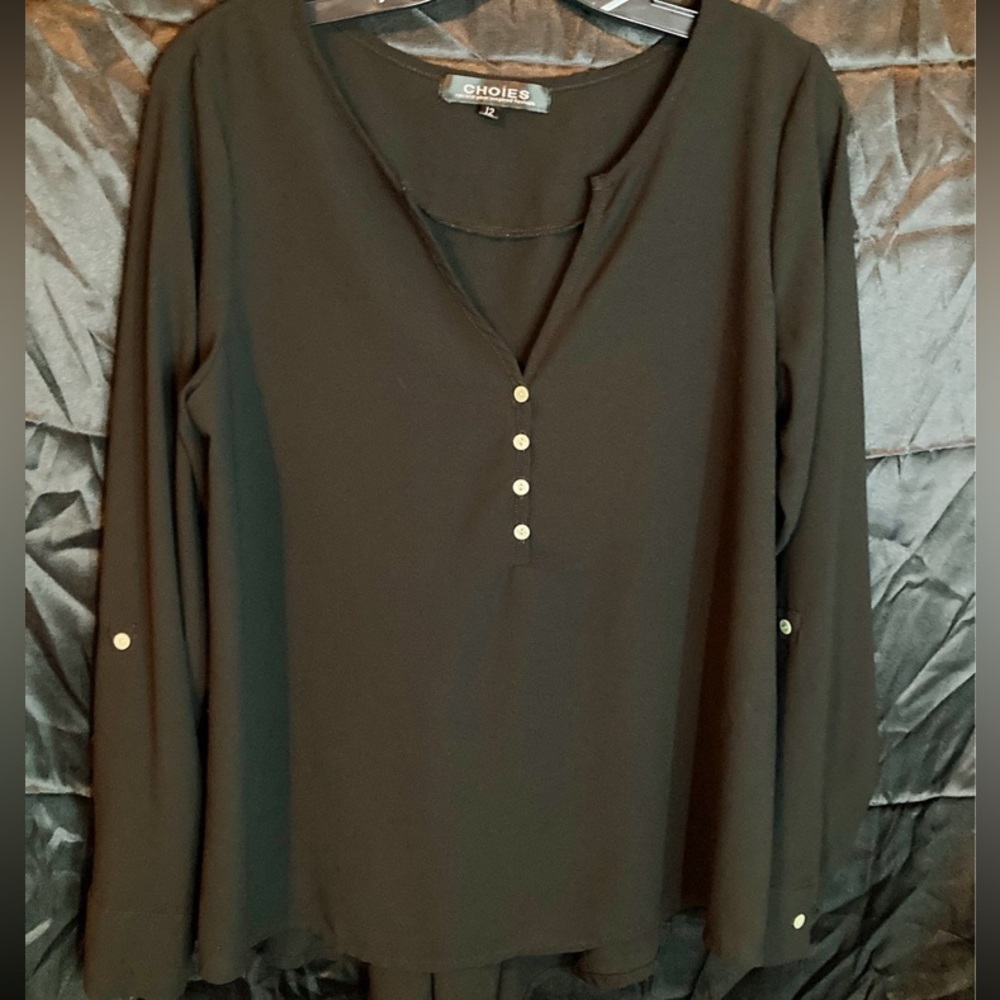 I am selling a Black Women’s Blouse.